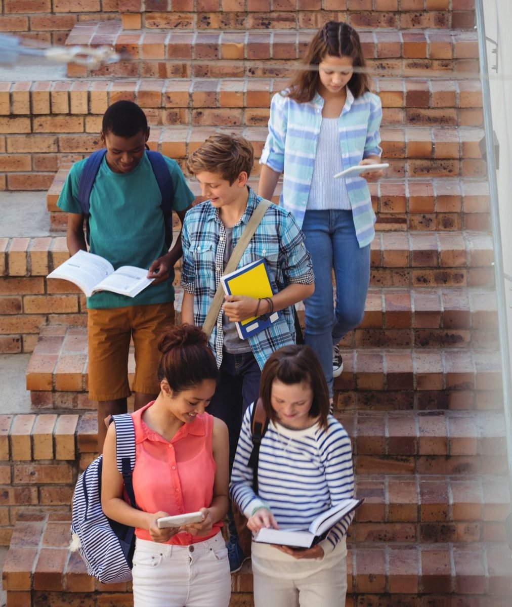 students moving down staircase e1669189513465